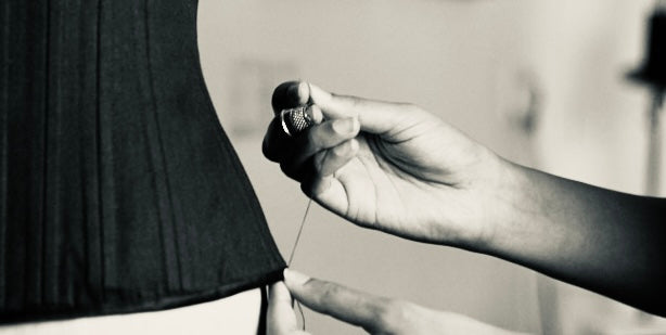Close-up of Deborah Brand sewing a bespoke corset.