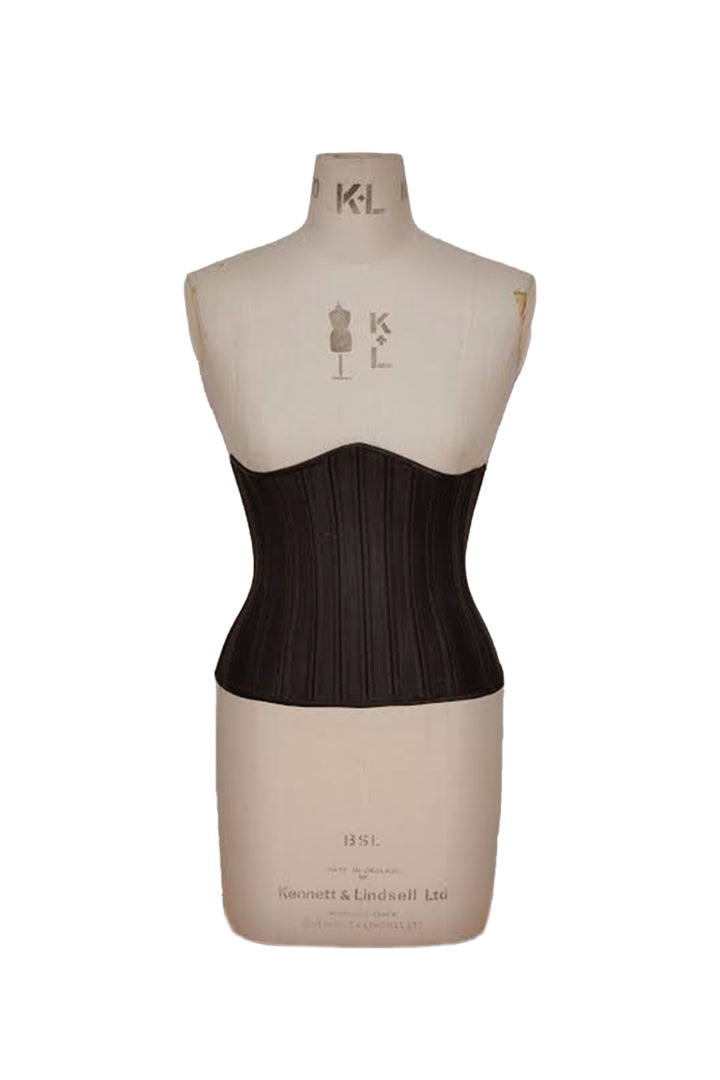 A black Deborah Brand Mila corset on a dress form 