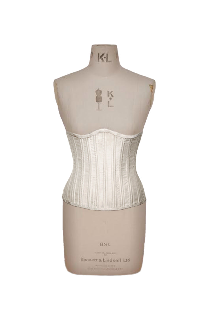 White Deborah Brand Mila corset on a dress form.
